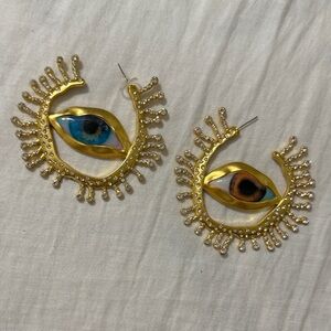 Artistic Gold Eye Earrings with Blue and Brown Accents